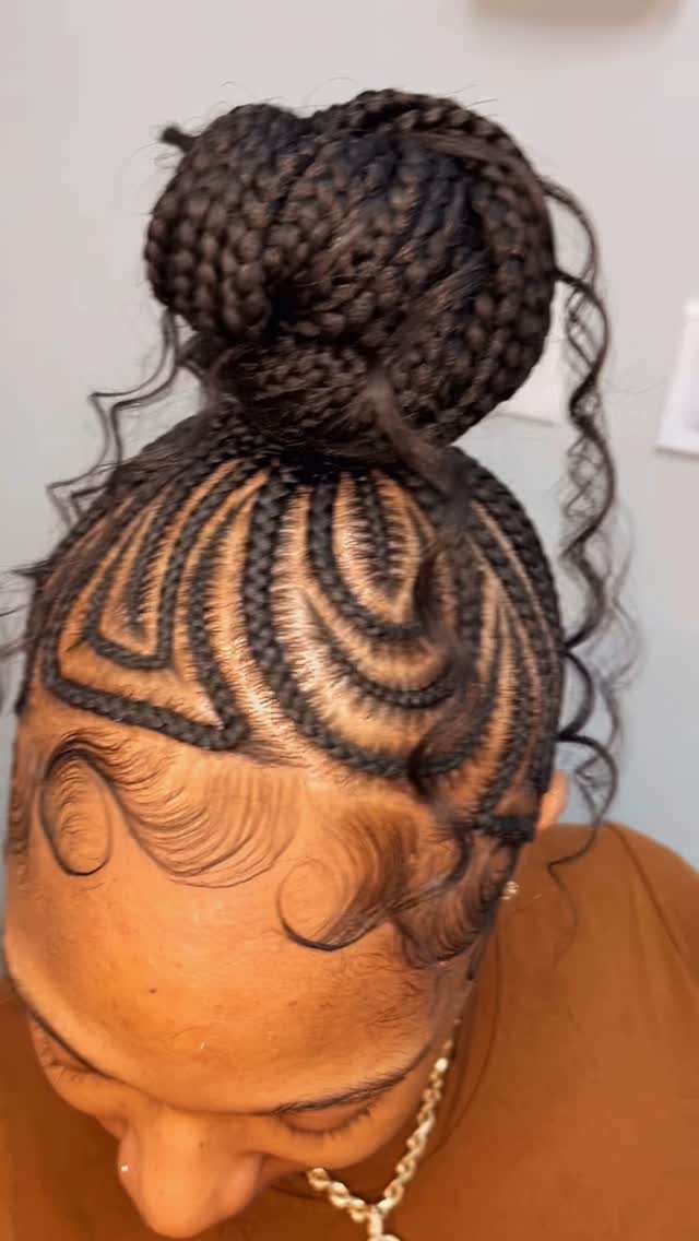 16 Bun Hairstyles for Homecoming: Updos, Braids and More 16 Intricate braided high bun hairstyle with curved cornrows and styled curly edges.
