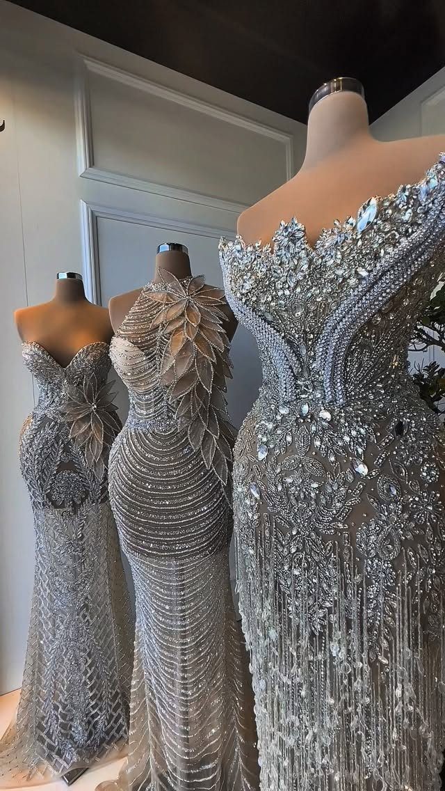 Celaena Sardothien Dresses: 10 Gown Ideas from the Books 10 Three silver embellished gowns with crystals and sequins displayed on mannequins.