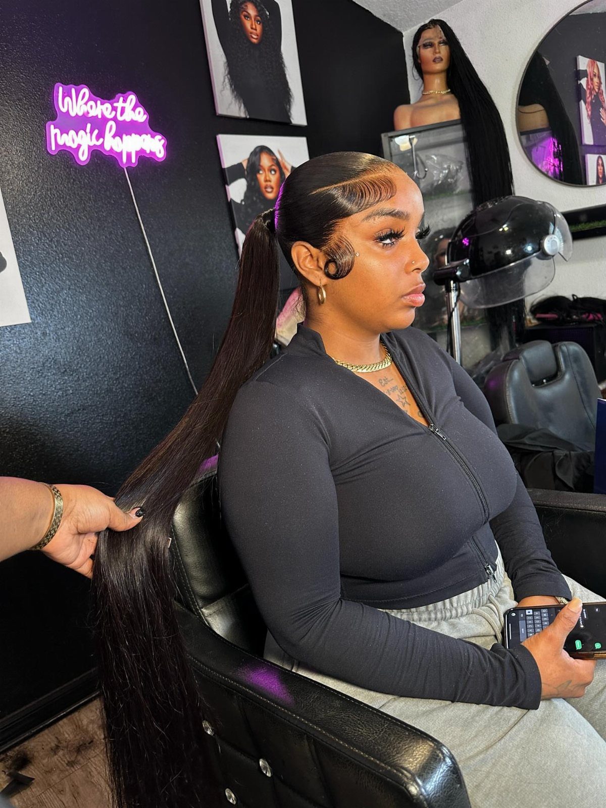 18 Cute Ponytail Hairstyles for Every Mood and Length 17 Woman with a long, sleek high ponytail sitting in a hair salon chair.