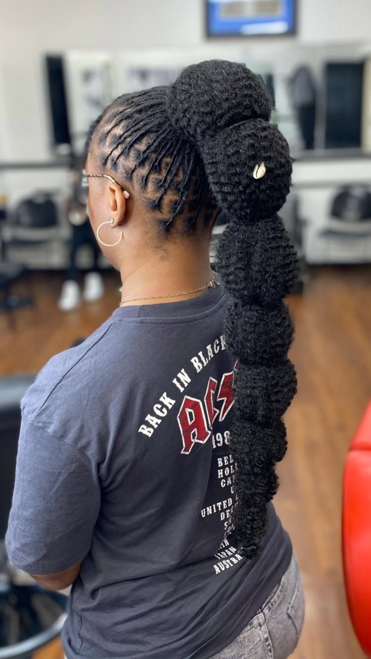 18 Cute Ponytail Hairstyles for Every Mood and Length 4 Woman with a high bubble ponytail and braided hair in a salon