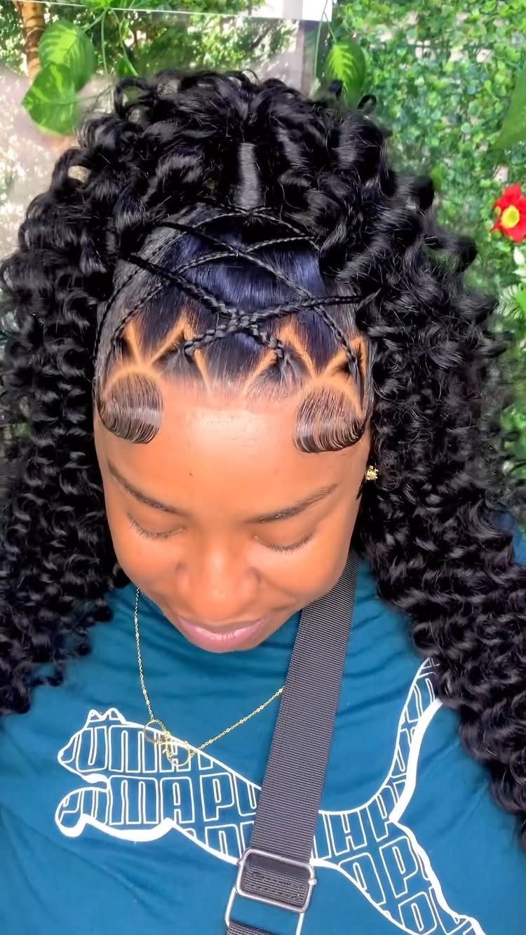 18 Cute Ponytail Hairstyles for Every Mood and Length 5 Woman with curly black hair in a braided half ponytail and styled edges.