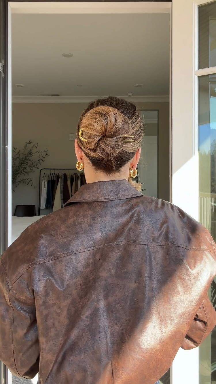 18 Cute Ponytail Hairstyles for Every Mood and Length 15 Low wrapped ponytail with gold bobby pins on a person in leather jacket