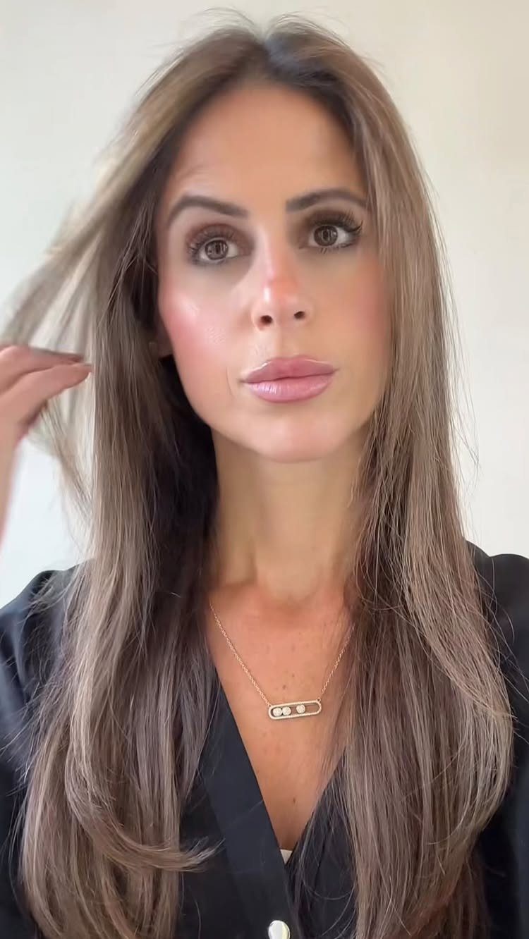 14 Different Color Hair Ideas for Every Skin Tone 1 Woman with long honey bronde hair blending blonde and brunette tones.