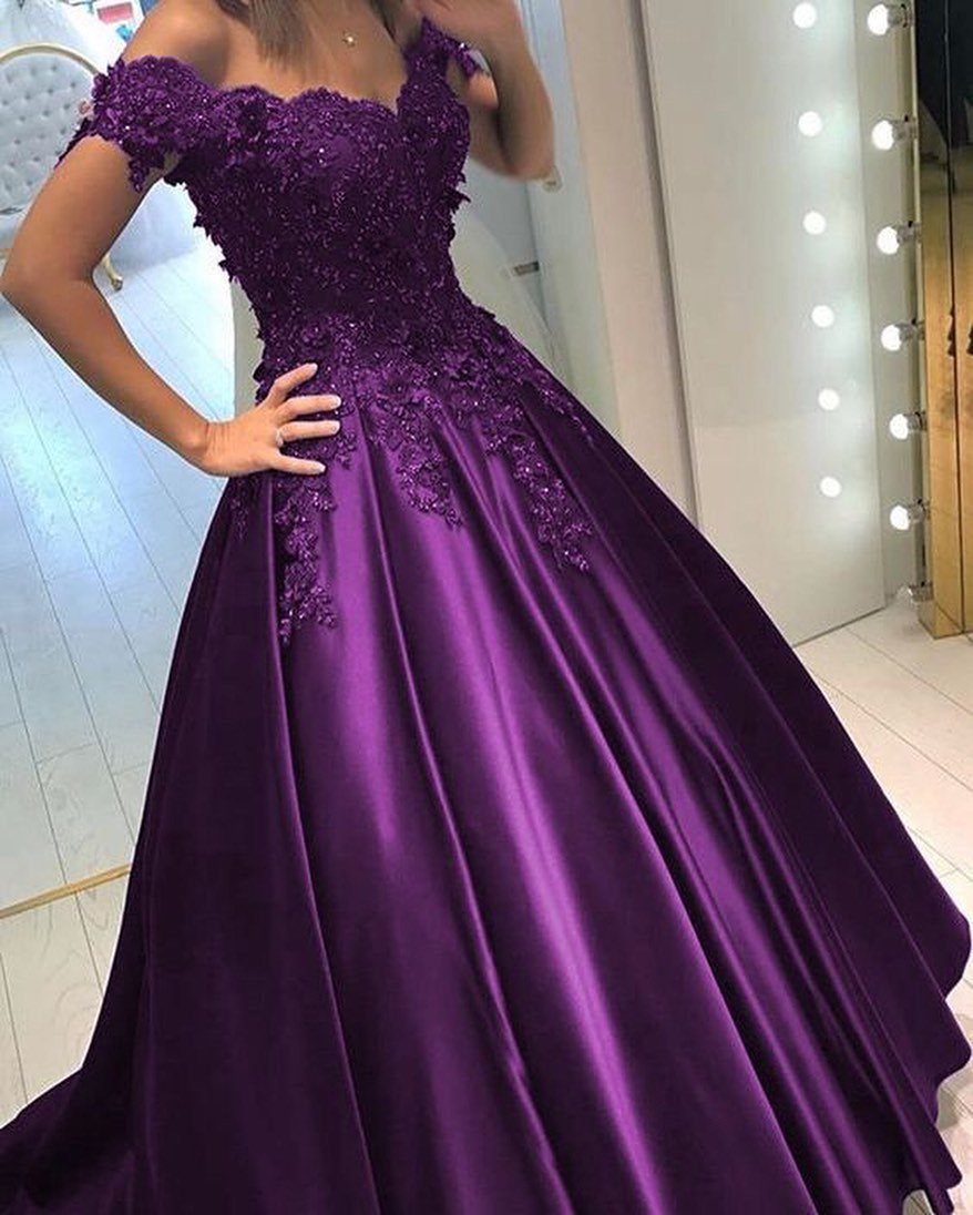 Purple satin ball gown with floral lace bodice and full skirt on person