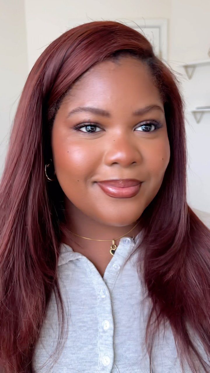 Fall Hairstyles and Color: 16 Ideas, Caramel to Espresso 4 Woman with long cinnamon copper hair wearing a grey shirt and gold necklace.