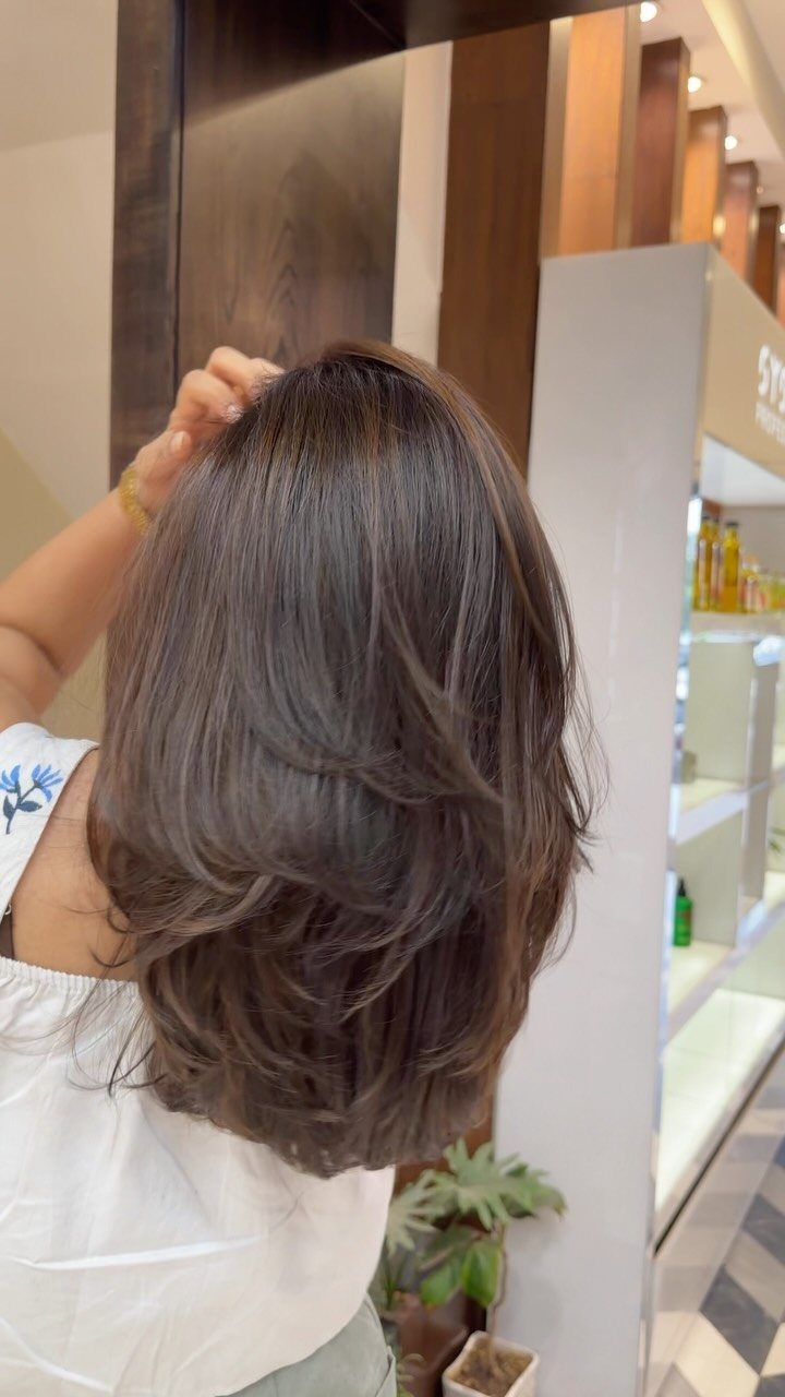 Fall Hairstyles and Color: 16 Ideas, Caramel to Espresso 11 Layered medium-length espresso brown hair with subtle highlights on a woman.