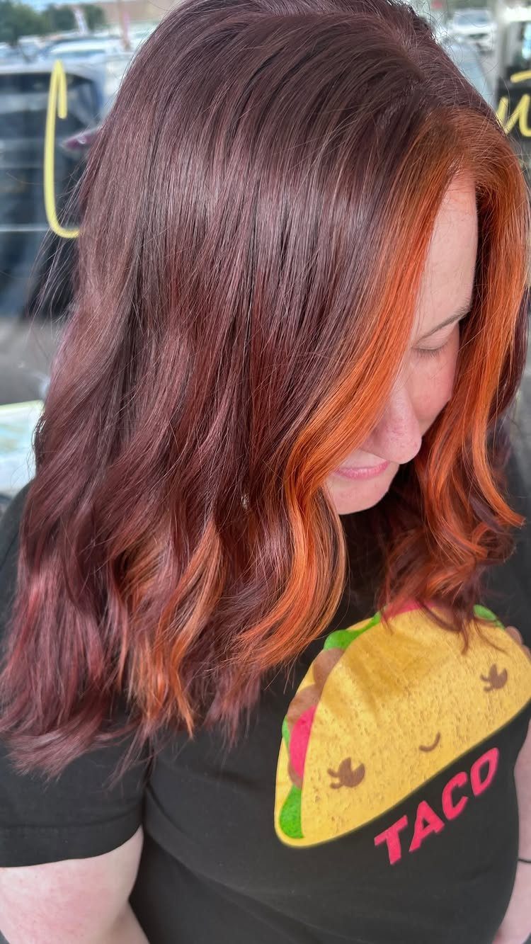 Fall Hairstyles and Color: 16 Ideas, Caramel to Espresso 6 Woman with wavy hair in bright orange-copper and deep red tones.