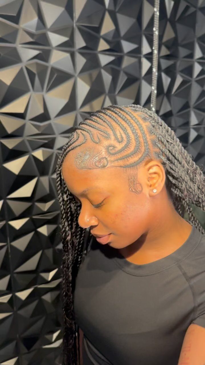 Woman with intricate curved cornrow braids and long individual braids against geometric wall