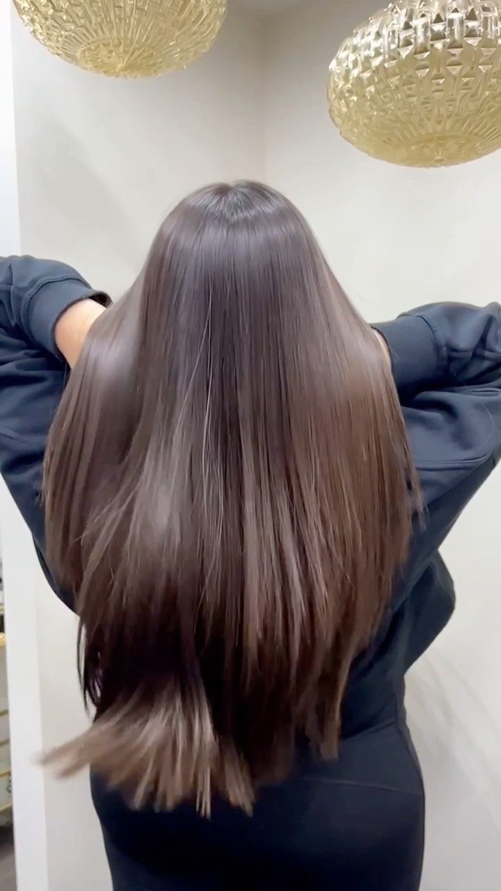 Long straight brown hair with a smooth, polished, and highly reflective finish.
