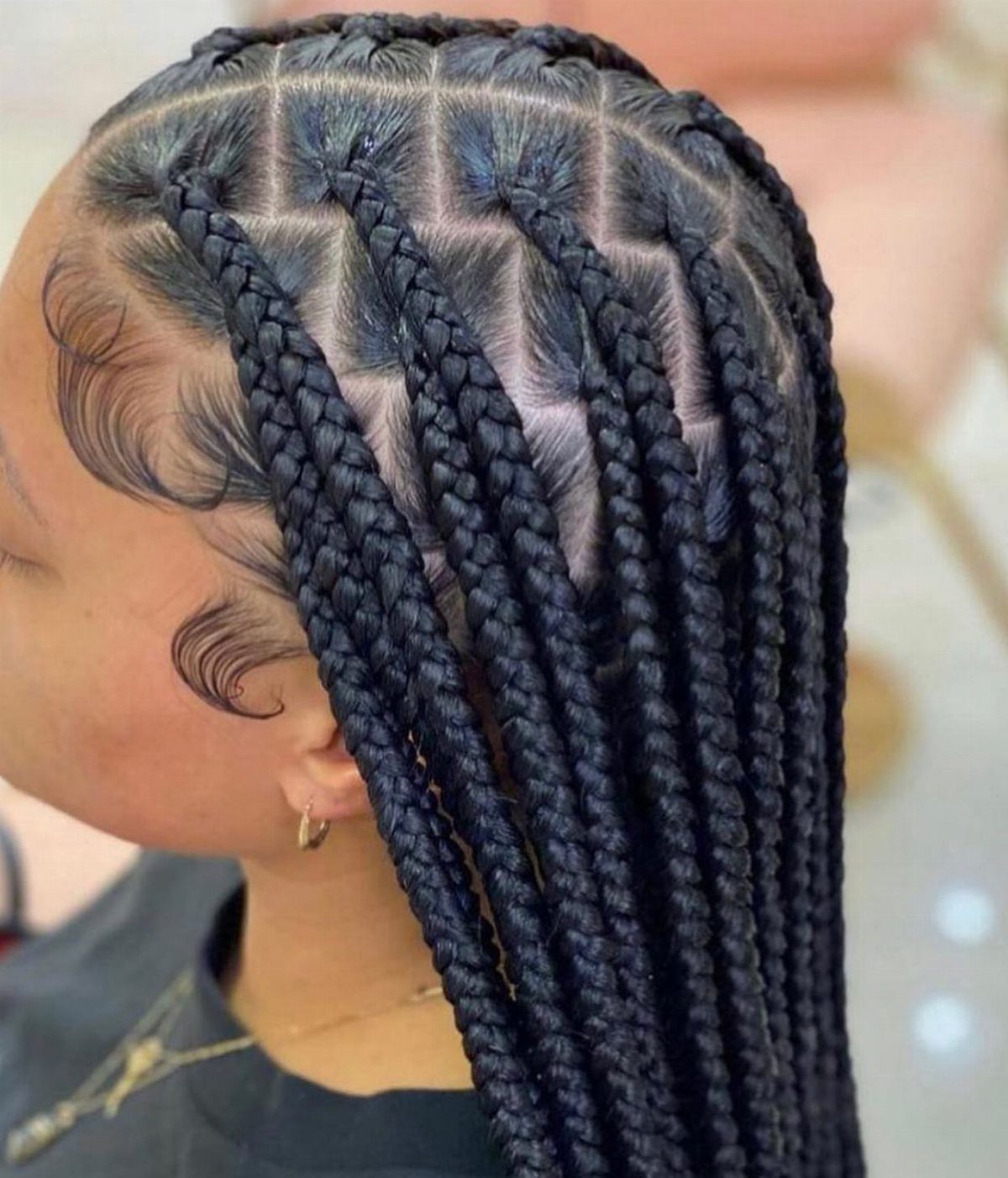 9 Long African Hair Ideas for Braids, Curls and Waves 2 Long black box braids with neat square partings on a woman's head.