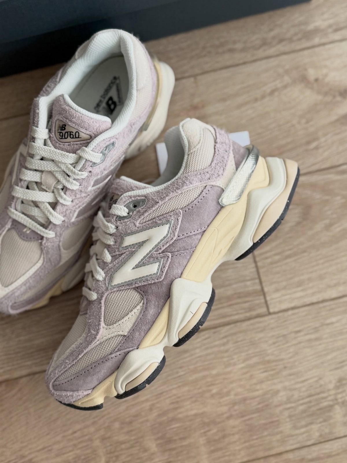 New Balance 9060 sneakers in truffle beige showing mesh and suede upper details.