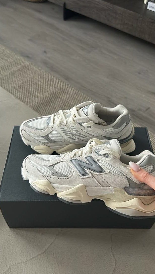 New Balance 9060 truffle sneakers resting on a black box showing the pod midsole