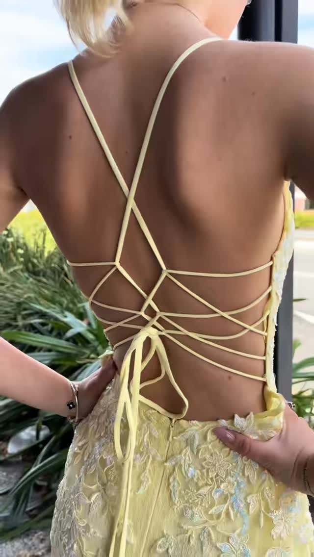 10 Nice Prom Dresses for Every Style and Body Type 10 Pale yellow lace dress with a criss-cross lace-up back worn by a person.