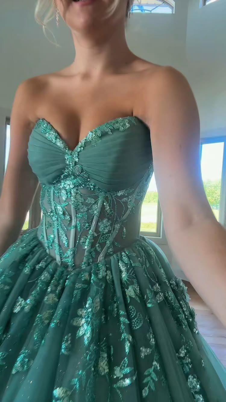 10 Nice Prom Dresses for Every Style and Body Type 6 Teal-green strapless formal gown with floral embroidery and a full voluminous skirt.