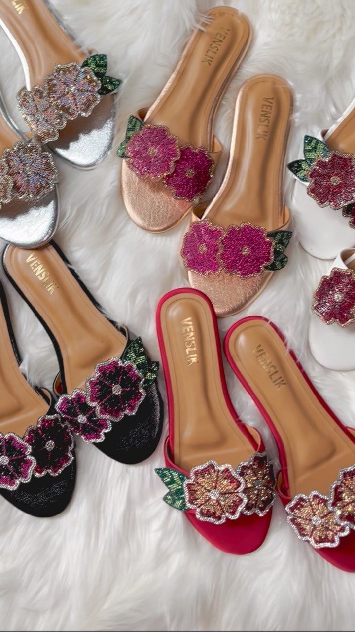 Night Out Shoes: 12 Styles From Flats to Stilettos 2 Embellished flat slide shoes with sparkling floral designs on a white fur background.