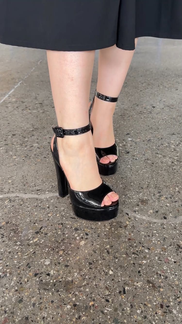 Night Out Shoes: 12 Styles From Flats to Stilettos 5 Black patent leather platform block heels with ankle straps on a concrete floor