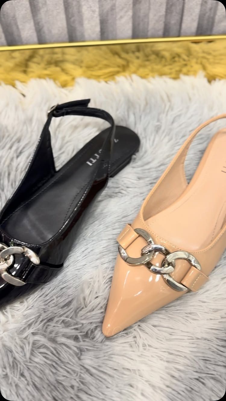 Night Out Shoes: 12 Styles From Flats to Stilettos 1 Pointed-toe flat shoes in black and nude with silver chain details on white fur.