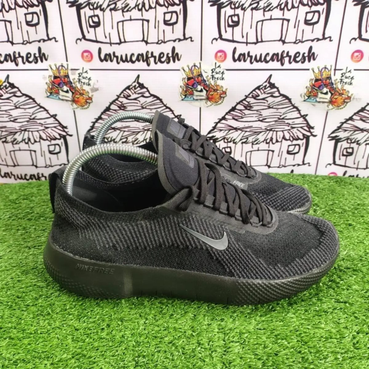 Nike Free Shoes: 7 Colorways and Styles to Wear Right Now 4 Black Nike Free sneakers with grey swoosh on green artificial grass background