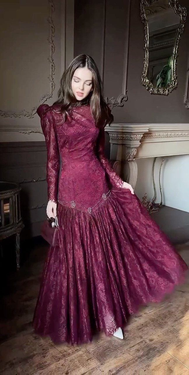 Period Piece Dresses: 5 Ideas, From Victorian to Steampunk 3 Woman in a burgundy lace Victorian-style gown standing in a vintage room.