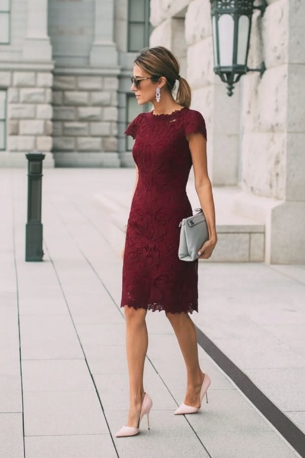 Semi Formal Gown vs Formal Gown: 6 Ideas to Compare 1 Woman in a burgundy lace knee-length dress and pink heels walking outdoors.