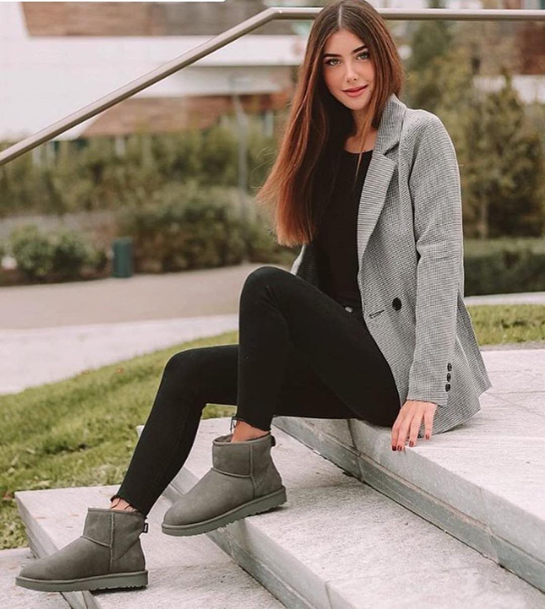 Short UGG Boots: 7 Outfit Ideas for Jeans, Skirts and Blazers 6 Woman sitting on concrete steps wearing olive green short ugg boots and blazer.