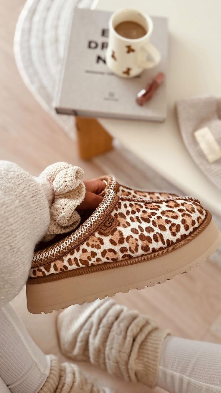 Uggs with Designs: 5 Ideas, From Leopard Print to Bows 2 Leopard print Ugg boots worn with white ribbed socks and cream knitwear.