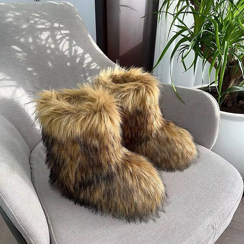 Winter Boots 2026: 8 Styles, From Slouchy to Shearling 7 Brown faux-fur boots resting on a light grey armchair next to a plant
